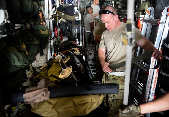 Staff Sgt. Andrew Harkcom, 379th Expeditionary Aeromedical Evacuation Squadron aeromedical evacuation technician, secures medical equipment to the litter prior to take off June 28, 2016, at Al Udeid Air Base, Qatar. The equipment package for an aeromedical evacuation mission contains roughly about 1,200 to 1,400 pounds of equipment on each mission. The aeromedical evacuation team ensures every piece of equipment is secured prior to take off to prevent items from moving during the flight. (U.S. Air Force photo/Senior Airman Janelle Patiño/Released)