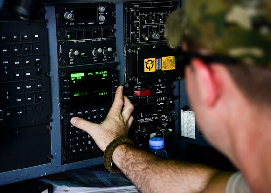 Capt. Steve Bichsel, 746th Expeditionary Airlift Squadron navigator, loads the navigation system of a C-130 Hercules prior to take off June 28, 2016, at Al Udeid Air Base, Qatar. Bichsel is deployed from the 914th Airlift Wing out of Niagara Falls Air Reserve Station, N.Y. This year marks the last time the 914th AW Airmen and four of its C-130’s last deploy here as they transition to KC-135 Stratotankers. (U.S. Air Force photo/Senior Airman Janelle Patiño/Released)