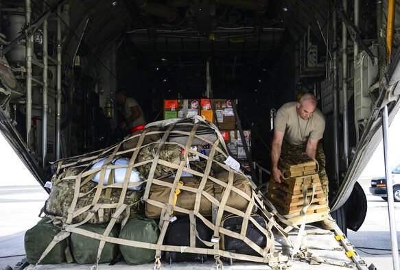 Master Sgt. Paul Serafini, 746th Expeditionary Airlift Squadron loadmaster, secures a milk stool ramp support platform and straps down a cargo load on a C-130 Hercules prior to take off June 28, 2016, at Al Udeid Air Base, Qatar. C-130 maintainers and operations group from the 914th Airlift Wing out of Niagara Falls Air Reserve Station, N.Y. have deployed here since 2005 to support the U.S. Air Forces Central Command’s mission. (U.S. Air Force photo/Senior Airman Janelle Patiño/Released)
