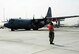 Senior Airman Steven Engels, 379th Expeditionary Aircraft Maintenance Squadron crew chief, marshals a C-130 Hercules on the flight line June 28, 2016, at Al Udeid Air Base, Qatar. Airmen from the 379th EAMXS are responsible for ensuring the aircraft are maintained to exact standards to support Operation Inherent Resolve and Operations Freedom’s Sentinel. (U.S. Air Force photo/Senior Airman Janelle Patiño/Released)