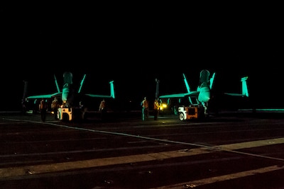 Sailors prepare to secure two F/A-18E Super Hornets to the flight deck of the aircraft carrier USS Dwight D. Eisenhower in the Persian Gulf, July 29, 2016. The Eisenhower and its carrier strike group were deployed in support of Operation Inherent Resolve, maritime security operations and theater security cooperation efforts in the U.S. 5th Fleet area of operations. Navy photo by Petty Officer 3rd Class Anderson W. Branch