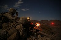 Lance Cpl. Login Loftis, a machine gunner with Company F, 2nd Battalion 5th Marine Regiment fires a M240 medium machine gun as Lance Cpl. Krikland Harrington, a machine gunner with Company F, 2/5, looks through his night vision optic to guide Loftis onto his target during Integrated Training Exercise 5-16 at Marine Air-Ground Combat Center Twentynine Palms Calif., August 18, 2016.  ITX is designed to bring together the ground combat, air combat and logistics combat elements of the Marine Corps into one fully capable and lethal unit ready to respond to global uncertainty. 