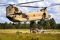 Paratroopers lift the reach pendant before slingloading a M777A2 howitzer to a CH-47 Chinook helicopter during a gun raid and live-fire exercise at Fort Bragg, N.C., Aug 12, 2016. Army photo by Capt. Adan Cazarez