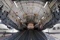 U.S. and Canadian soldiers load an Avenger air defense system, which includes support vehicles, onto a Canadian air force Globemaster III aircraft in Greenville, S.C., Aug. 13, 2016. Army National Guard photo by Staff Sgt. Roby Di Giovine
