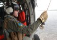 Navy Petty Officer 1st Class Christopher Nelson prepares to conduct search and rescue extraction training from a MH-60S helicopter at Naval Support Activity Panama City, Fla., Aug. 24, 2016. The helicopter and crew are assigned to assigned to Naval Surface Warfare Center Panama City Division's aviation unit. Navy photo by Petty Officer 2nd Class Fred Gray IV