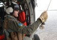 Navy Petty Officer 1st Class Christopher Nelson prepares to conduct search and rescue extraction training from a MH-60S helicopter at Naval Support Activity Panama City, Fla., Aug. 24, 2016. The helicopter and crew are assigned to assigned to Naval Surface Warfare Center Panama City Division&#39;s aviation unit. Navy photo by Petty Officer 2nd Class Fred Gray IV