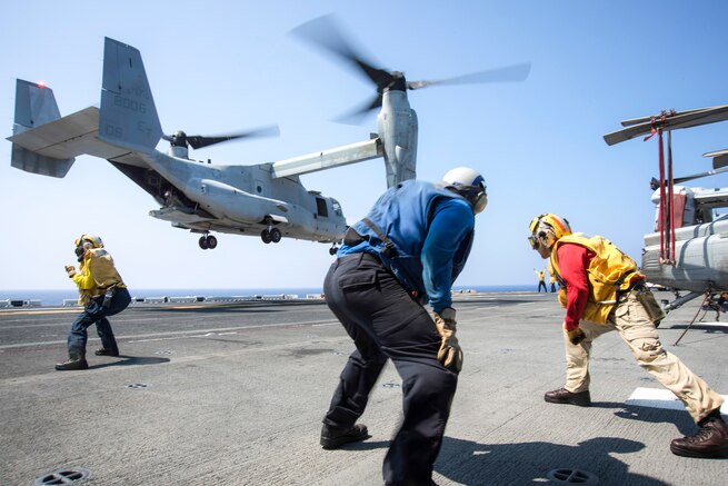 Sailors guide an MV-22 Osprey onto the amphibious assault ship USS Bonhomme Richard in the Philippine Sea, Aug. 24, 2016. The Richard is operating in the U.S. 7th Fleet area of operations to support security and stability in the Indo-Asia-Pacific region. Navy photo by Petty Officer 2nd Class Diana Quinlan