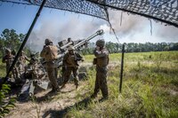 The 18th Sergeant Major of the Marine Corps, Ronald L. Green, participates in a live fire mission with Battery A, 1st Battalion, 10th Marines at Fort Stewart, GA, Aug 24, 2016.  