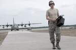 Air Force Senior Airman Zachary Allen, a flight equipment technician assigned to the 120th Airlift Wing, Montana Air National Guard, returns from post-flight-checking aircrew equipment aboard a C-130 Hercules cargo aircraft during Northern Strike Exercise 2016 in Alpena, Mich., Aug. 11, 2016. Air National Guard photo by Master Sgt. Leisa Grant