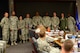 U.S. Airmen from the 20th Equipment Maintenance Squadron are recognized by Col. Daniel Lasica, 20th Fighter Wing commander, right, and Chief Master Sgt. Christopher McKinney, 20th FW command chief, left, at Shaw Air Force Base, S.C., Nov. 30, 2016. Airmen from the 20th EMS added decals to a scale model of an F-16CM Fighting Falcon in front of the 20th FW headquarters building so it more closely resembles the F-16s currently assigned to Shaw. (U.S. Air Force photo by Airman 1st Class BrieAnna Stillman)