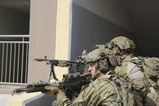An M-240 machine gun team from 1st Special Forces Group (Airborne) sets up a suppressive base of fire during urban warfare training on the Republic of Korea.  U.S. and Republic of Korea Special Forces conducted a complex joint-combined training event to increase combined SOF agility and interoperability.  (SOCKOR Photo/SPC Cody Mendenhall)