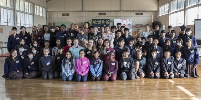 Matthew C. Perry and Takamori Midori Junior High School students pose for a photo during a cultural exchange event at Takamori Midori Junior High School in Kuga, Japan, Feb. 2, 2016. Traditionally, Midori Junior High School visits M.C. Perry annually and was excited to invite the American students into their own school this year.