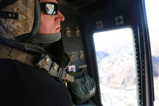 A crew chief with Marine Light Attack Helicopter Squadron (HMLA) 267 waits for a UH-1Y Huey to reach the simulated targets during exercise Scorpion Fire 1-16 near Navy Air Facility El Centro, Calif. Jan. 25.  HMLA-267 supported the exercise with close air support and live-fire capabilities, Jan. 25 to Feb. 5.