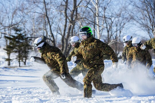 U.S. Marines and Japan Ground Self-Defense Force Soldiers sprint forward to capture the flag during a snowball fight championship for Forest Light 16-2 in Yausubetsu Training Area, Hokkaido, Japan, Jan. 31, 2016. Forest Light, a semi-annual exercise between the JGSDF and III Marine Expeditionary Force, strengthens military partnership, solidifies regional security agreements and improves individual and unit-level skills. The JGSDF soldiers are with the 27th Infantry Regiment, 5th Brigade, Northern Army. The Marines are with 3rd Battalion, 5th Marine Regiment currently assigned to 4th Marine Regiment, 3rd Marine Division, III MEF through the unit deployment program. (U.S. Marine Corps Photo by Cpl. Tyler S. Giguere/Released)