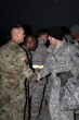 From left, Col. Mark Holler, commander, 35th Air Defense Artillery Brigade greets Capt. Daniel Ruiz, commander of Delta Battery, 1st Battalion, 43rd ADA Regiment assigned to 11th ADA Brigade, Fort Bliss, Texas, upon Ruiz's arrival to Osan Air Base, Feb. 8.  (U.S. Army photo/Staff Sgt. Kelly Carlton)