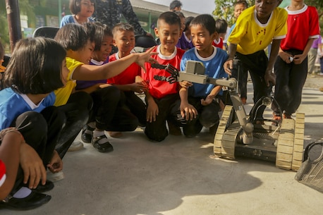 Children at Kao Chi Chan School, Sattahip District, Thailand, interact with explosive ordnance disposal robots during exercise Cobra Gold, Feb. 14, 2016. Cobra Gold, in its 35th iteration, includes a specific focus on humanitarian civic action, community engagement and medical activities conducted during the exercise to support the needs and humanitarian interests of civilian populations around the region. 