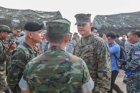 U.S. Marine Corps Brigadier General Russell A. Sanborn, Commanding General, 1st Marine Aircraft Wing speaks with members of the Royal Thai armed forces during an amphibious capabilities demonstration at Hat Yao beach, Rayong, Thailand, during exercise Cobra Gold 16, Feb. 12, 2016. CG16 a multinational training exercise developed to strengthen security and interoperability between the Kingdom of Thailand, the U.S. and other participating nations. 