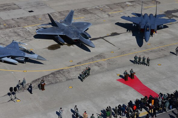 A U.S. Air Force F-22 "Raptor" fighter aircraft from Kadena Air Base, Japan, is flanked by an F-16 Fighting Falcon and a Republic of Korea air force F-15 Slam Eagle at Osan Air Base, ROK, Feb. 17,2016. The Raptor was part of a flyover formation of 12 aircraft demonstrating the strength of the ROK/U.S. alliance in response to recent provocative actions by North Korea. 
(U.S. Air Force photo by Staff Sgt. Amber Grimm/Released)