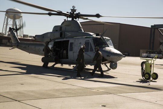 Marines with Marine Light Attack Helicopter Squadron 469 (HMLA-469), based out of Marine Corps Air Station Camp Pendleton, Calif., perform pre-flight inspections on a UH-1Y “Venom” aboard Marine Corps Air Station Yuma, Ariz., Friday, Feb. 5, 2016.