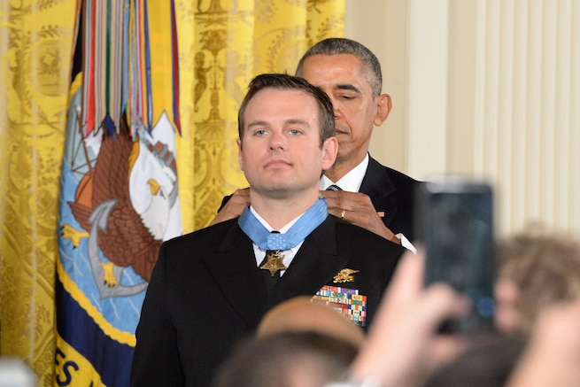 President Barack Obama presents the Medal of Honor to Navy Senior Chief Petty Officer Edward C. Byers Jr. during a White House ceremony, Feb. 29, 2016. Byers received the medal for actions while serving as part of a team that rescued an American civilian held hostage in Afghanistan in 2012. DoD photo by EJ Hersom