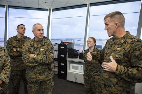 U.S. Marine Corps MajGen. Charles L. Hudson, commanding general of Marine Corps Installations Command, receives a brief from Col. Jason G. Woodworth, commanding officer of Marine Corps Air Station Miramar, about flightline operations aboard MCAS Miramar, San Diego, Calif., Dec. 11, 2015. MajGen. Hudson inspects the base for collateral in hope to improve quality and mission for Marines stationed aboard MCAS Miramar. (U.S. Marine Corps photo by Lance Cpl. Travis Jordan/Released)