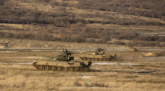 U.S. Marine M1A1 Abrams tanks and Bulgarian T-72 tanks conduct maneuver training during Platinum Lion 16-2 at Novo Selo Training Area, Bulgaria, Jan. 8, 2016. Exercise Platinum Lion provides combined training with NATO Allies and partners, demonstrating our commitment to promoting a peaceful and stable Europe through theatre security cooperation engagements. (U.S. Marine Corps Photo by Cpl. Justin T. Updegraff/ Released)