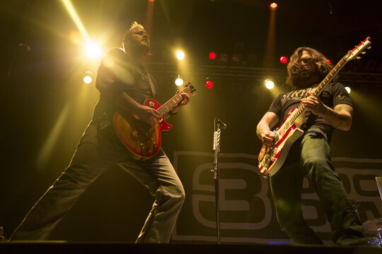 Chet Roberts, left, and Chris Henderson, right, lead and rhythm guitarists of 3 Doors Down, perform during a free concert for residents of Marine Corps Air Station Iwakuni, Japan, Jan. 14, 2105. Members of the band said they do these tours in order to give back to the men and women who have already given so much.