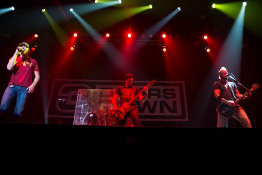 From left to right, Brad Arnold, Justin Biltonen, and Chet Roberts, members of 3 Doors Down, perform during a free concert for residents of Marine Corps Air Station Iwakuni, Japan, Jan. 14, 2016. Members of the band said they do these tours in order to give back to the men and women who have already given so much.