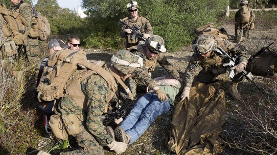 U.S. Marines with Special-Purpose Marine Air-Ground Task Force Crisis Response-Africa prepare to lift a simulated casualty onto a field litter during quick-response training at Naval Station Rota, Spain, January 23, 2016. SPMAGTF-CR-AF is a self-sustaining crisis response force prepared for the protection of American personnel and facilities on the African continent when directed.