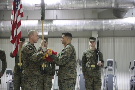 Sgt. Maj. Brian Alsleben, left, sergeant major of 1st Battalion, 8th Marines uncases the colors alongside Lt. Col. Justin Ansel, right, commanding officer of 1st Battalion, 8th Marines during the transfer of authority ceremony aboard Mihail Kognalniceanu Air Base, Romania, Jan. 22, 2016. The rotational force of Marines and sailors gives U.S. European Command the continuous capability to integrate with NATO and partner nations in Eastern Europe. (U.S. Marine Corps photo by Cpl. Immanuel M. Johnson/Released)