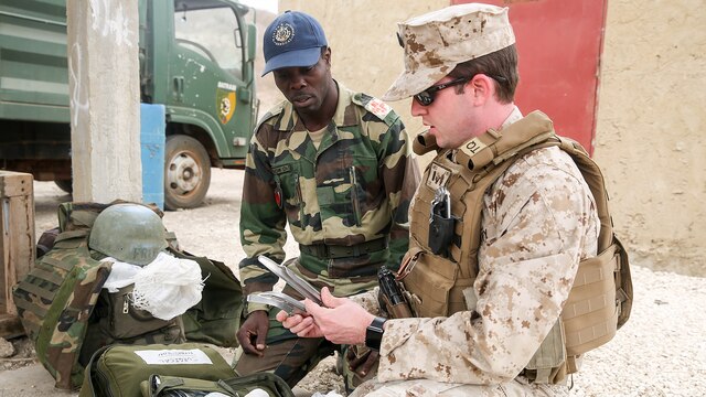 Lt. j.g. David Lane, a physician assistant with Special Purpose Marine Air-Ground Task Force Crisis Response-Africa, demonstrates appropriate use of medical equipment to medical personnel from the Compagnie Fusilier de Marin Commando in Thies, Senegal, June 22 2016. Marines and the COFUMACO conducted a three-week training exercise that included advanced combat firing techniques, a machine gun range and a live-fire platoon attack range. 