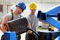 Air Force Tech. Sgt. Ben Kipp, left, and Staff Sgt. Benjamin Keeler fill up a scissor lift vehicle during construction of the Commando Warrior Field Training Facility at Andersen Air Force Base, Guam, June 21, 2016. Kipp and Keeler are assigned to the New Hampshire Air National Guard’s 157th Civil Engineering Squadron. Air National Guard photo by Tech. Sgt. Aaron Vezeau