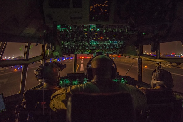 U.S. Air Force pilots from the Alaska Air National Guard's 144th Airlift Squadron prepare to take off in a C-130 Hercules at an undisclosed location in Southwest Asia, June 17, 2016. The transport mission was one of the last combat missions during the 144th AS's final C-130 deployment. (U.S. Air Force photo by Staff Sgt. Douglas Ellis/Released)