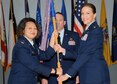Col. Imelda Reedy, 14th Medical Group Commander, passes the 14th Medical Support Squadron guidon to Lt. Col. Jennifer Baggott, the new 14th MDSS Commander, during a change of command ceremony July 1 at Columbus Air Force Base, Mississippi. (U.S. Air Force photo/Melissa Doublin)