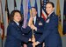 Col. Imelda Reedy, 14th Medical Group Commander, passes the 14th Medical Support Squadron guidon to Lt. Col. Jennifer Baggott, the new 14th MDSS Commander, during a change of command ceremony July 1 at Columbus Air Force Base, Mississippi. (U.S. Air Force photo/Melissa Doublin)