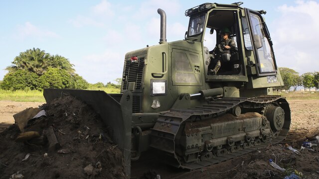A Honduran engineer operates a D6K Bulldozer during a partner nation construction project between Honduran service members and U.S. Marines with Special Purpose Marine Air-Ground Task Force - Southern Command at Puerto Castilla, Honduras, June 24, 2016. The Marines worked side by side with their Honduran counterparts on different construction and restoration projects, and shared knowledge and experience on techniques including maintenance and operation of heavy equipment.