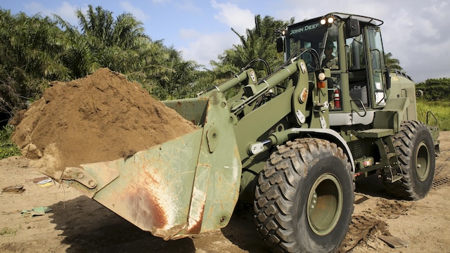 Cpl. Ivan A. Barbosa, a heavy equipment operator with Special Purpose Marine Air-Ground Task Force - Southern Command, operates a 624KR TRAM during a partner-nation construction project between Honduran service members and U.S.