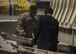 Staff Sgt. Jacob Chavez, 455th Expeditionary Logistics Readiness Squadron Central Command material recovery element, guides a vehicle ramp into place, July 14, 2016, Bagram Airfield, Afghanistan. The 455th ELRS CMRE team assesses and loads cargo, for future shipments. When dealing with retrograde HMMWVs, CMRE added a vehicle mechanic to their group to oversee the load. (U.S. Air Force photo by Senior Airman Justyn M. Freeman)