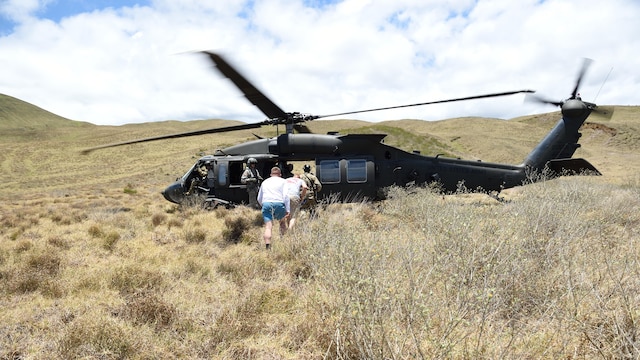 A pararescueman with the 320th Special Tactics Squadron escorts two simulated earthquake survivors to be evacuated from the area to safety in a UH-60 Blackhawk during a humanitarian assistance and disaster response scenario as part of Rim of the Pacific 2016, at Pohakuloa Training Area, Hawaii, July 10, 2016. RIMPAC offers the 320th Special Tactics and III Marine Expeditionary Force an opportunity to team up and practice their unique skills to strengthen their partnership in order to respond to crises quickly. Twenty-six nations, more than 40 ships and submarines, more than 200 aircraft and 25,000 personnel are participating in RIMPAC from June 30 to Aug. 4, in and around the Hawaiian Islands and Southern California. The world's largest international maritime exercise, RIMPAC provides a unique training opportunity that helps participants foster and sustain the cooperative relationships that are critical to ensuring the safety of sea lanes and security on the world's oceans. RIMPAC 2016 is the 25th exercise in the series that began in 1971.
