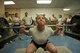 Master Sgt. Lindsey Glover, 455th Expeditionary Aircraft Maintenance Squadron, competes in the squat portion of a power lifting competition, July 15, 2016, Bagram Airfield, Afghanistan. The competition included squats, bench press, and deadlifts. (U.S. Air Force photo by Capt. Korey Fratini)