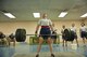 Master Sgt. Lindsey Glover, 455th Expeditionary Aircraft Maintenance Squadron, lifts a barbell while performing a deadlift during a power lifting competition, July 15, 2016, Bagram Airfield, Afghanistan. Glover participated in a power lifting competition that included squats, bench press, and deadlifts organized by the 455th EAMXS. (U.S. Air Force photo by Capt. Korey Fratini)
