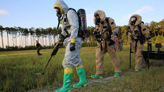 Marines with Marine Corps Air Station Cherry Point’s Explosive Ordnance Disposal and 2nd Marine Aircraft Wing’s Chemical, Biological, Radiological and Nuclear Defense sweep the area around a simulated incident site during a training exercise at MCAS Cherry Point, N.C., July 12, 2016. The purpose of the training was to further refine the interoperability between EOD and CBRN. 