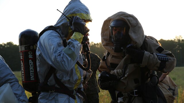 Marines with Marine Corps Air Station Cherry Point’s Explosive Ordnance Disposal and 2nd Marine Aircraft Wing’s Chemical, Biological, Radiological and Nuclear Defense conduct radio checks during a training exercise at MCAS Cherry Point, N.C., July 12, 2016. The training further refined the interoperability between EOD and CBRN. 