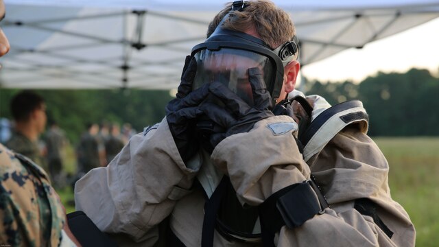 Lance Cpl. Ryan Shriver dons his gas mask during a training exercise at Marine Corps Air Station Cherry Point, N.C., July 12, 2016. The purpose of the training was to further refine the interoperability between MCAS Cherry Point’s Explosive Ordnance Disposal and 2nd Marine Aircraft Wing’s Chemical, Biological, Radiological and Nuclear Defense. Shriver is a CBRN defense specialist with Marine Wing Headquarters Squadron 2. 
