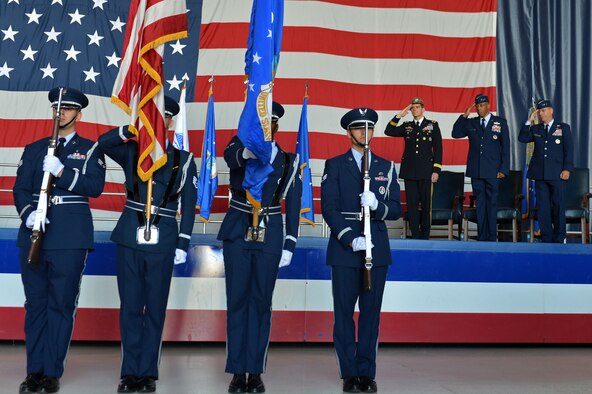 U.S. Army Gen. Joseph L. Votel, U.S. Central Command commander, U.S. Air Force Lt. Gen. Charles Q. Brown Jr., U.S. Air Forces Central Command outgoing commander, and U.S. Air Force Lt. Gen. Jeffrey L. Harrigian, U.S. Air Forces Central Command commander, salute the U.S. flag during a change of command ceremony at Shaw Air Force Base, S.C., July 22, 2016. Outgoing and incoming commanders exchange a unit’s guidon to symbolize relinquishment and assumption of command. (U.S. Air Force photo by Airman 1st Class Christopher Maldonado/Released)