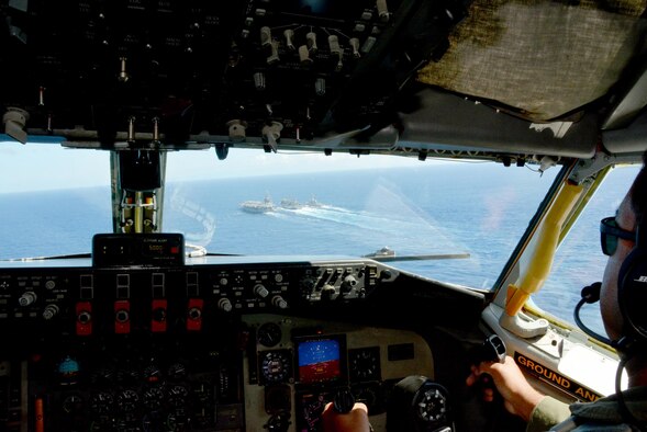 A KC-135R Stratotanker flown by the 465th Air Refueling Squadron, Tinker Air Force Base, Oklahoma, makes a low-approach near the Nimitz-class aircraft carrier USS John C. Stennis (CVN 74), during an underway replenishment in the Pacific Ocean, July 26, 2016. (U.S. Air Force Photo by Tech. Sgt. Lauren Gleason)