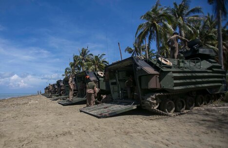 TANDUO BEACH, MALAYSIA (May 30, 2016) – U.S. Marines assigned to Easy Company, Battalion Landing Team, 2nd Battalion, 2nd Marines, let down ramps of Amphibious Assault vehicles after an amphibious transition from ship to shore. The Marines are embarked with U.S. Sailors aboard the USS Ashland (LSD 48) in support of exercise Cooperation Afloat Readiness and Training. CARAT is a series of annual, bilateral maritime exercises between the U.S. Navy, U.S. Marine Corps and the armed forces of nine partner nations to include Bangladesh, Brunei, Cambodia, Indonesia, Malaysia, Singapore, the Philippines, Thailand and Timor-Leste. The Ashland is assigned to U.S. 7th Fleet.  (U.S. Navy photo by Lance Cpl. Carl King Jr/. Released)