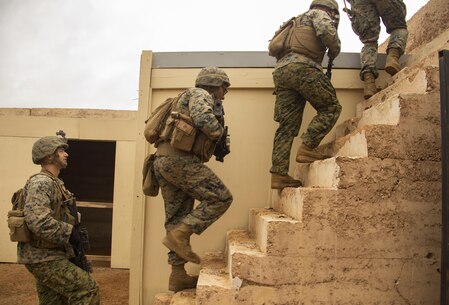 Marines with Company C, 1st Battalion, 1st Marine Regiment, move to the roof of a building to post security during Exercise Predator Strike at Cultana Training Area, South Australia, Australia, June 5, 2016. Predator Strike, a yearly exercise taken place in Australia with Marine Rotational Force – Darwin, allows Marines to enhance their skills and train with the Australian Defence Force.
