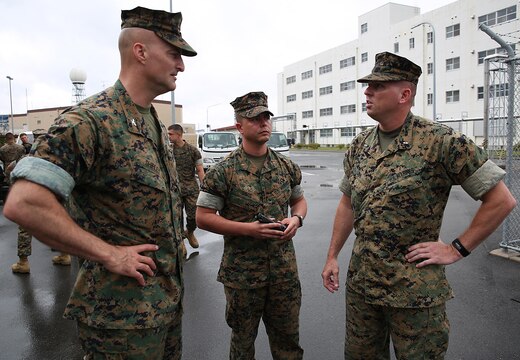 From left to right, U.S. Marine Corps Col. Daniel Shipley, commanding officer of Marine Aircraft Group 12, Chief Warrant Officer Jonathan B. Davis, Chemical, Biological, Radiological and Nuclear officer in charge with MAG-12, and Chief Warrant Officer Christopher Joy, CBRN defense officer with 3rd Marine Division, CBRN defense platoon, Headquarters Battalion, III Marine Expeditionary Force, discuss mission objectives during exercise Habu Sentinel 16, at Disaster Village, Marine Corps Air Station Iwakuni, Japan, June 7, 2016. Third Marine Division CBRN Marines traveled to MCAS Iwakuni for this event and worked with MAG-12 personnel in developing technical skills critical to their profession.  As the annual capstone exercise for the division’s response element, this event encompasses multiple objectives specific to CBRN response and validates unit standard operating procedures in an unfamiliar training environment. (U.S. Marine Corps photo by Sgt. Jessica Quezada/Released)