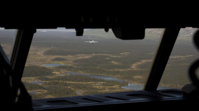 A KC-130J Super Hercules from Marine Aerial Refueler Transport Squadron 152, homestationed at Marine Corps Air Station Iwakuni, Japan, flies through the Chugach Mountains valley May 28, 2016. The squadron trained at Joint Base Elmendorf-Richardson, Alaska, in support of exercise Kodiak Mace. Kodiak Mace is an annual joint exercise designed to give the U.S. Marine pilots of VMGR-152 an opportunity to conduct low altitude training in an environment outside of what their used to, to enhance their technical skills in a foreign environment. (U.S. Marine Corps photo by Cpl. Cory Schubert/Released)